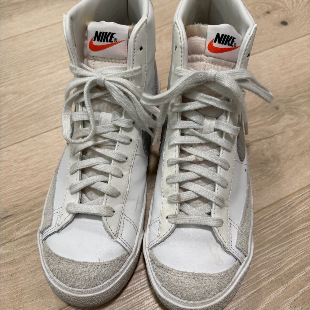 Nike White Sneakers with Orange Logo and Light Gray Accents